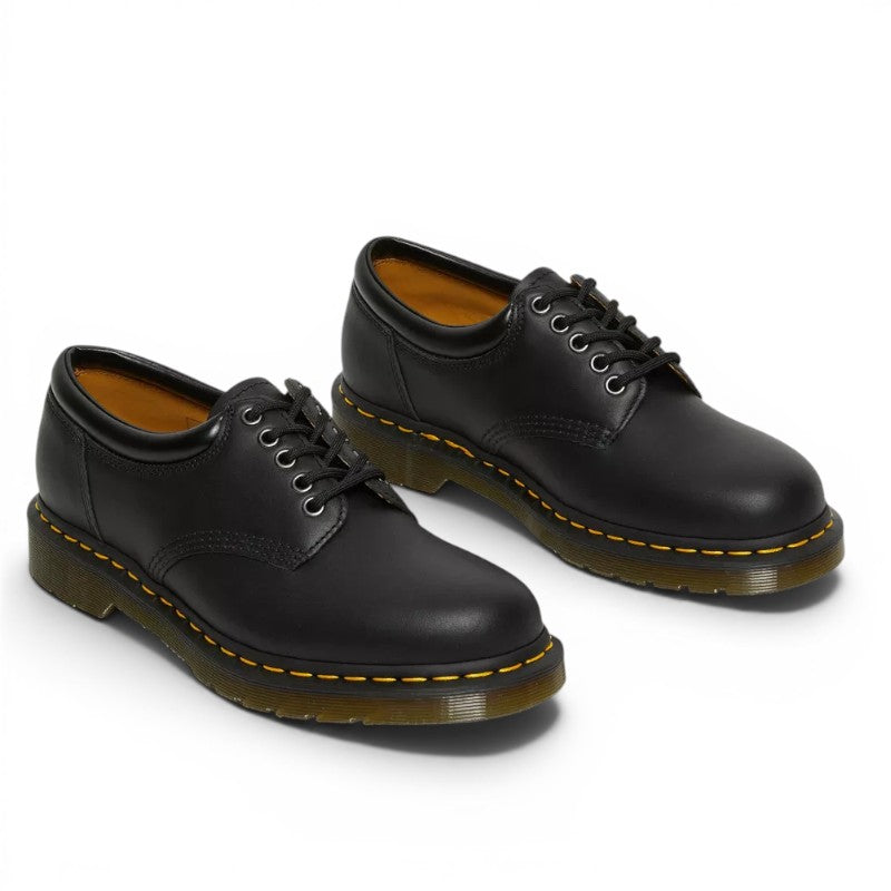 My Store Dr. Martens 8053 black nappa leather low-top shoes with yellow stitching and lace-up closure.