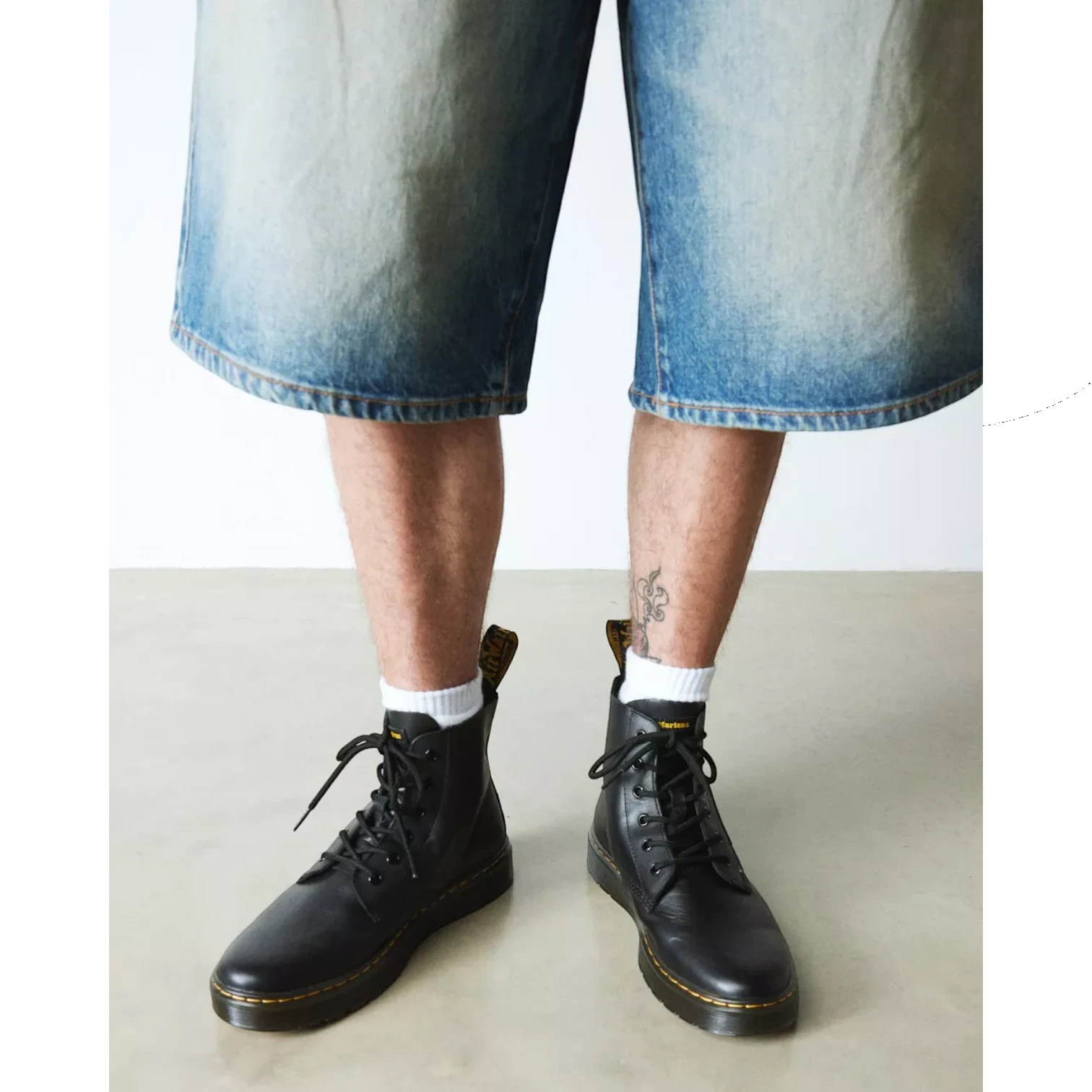 My Store Dr. Martens Thurston Lusso Leather Chukka boots in black with yellow stitching and laces.