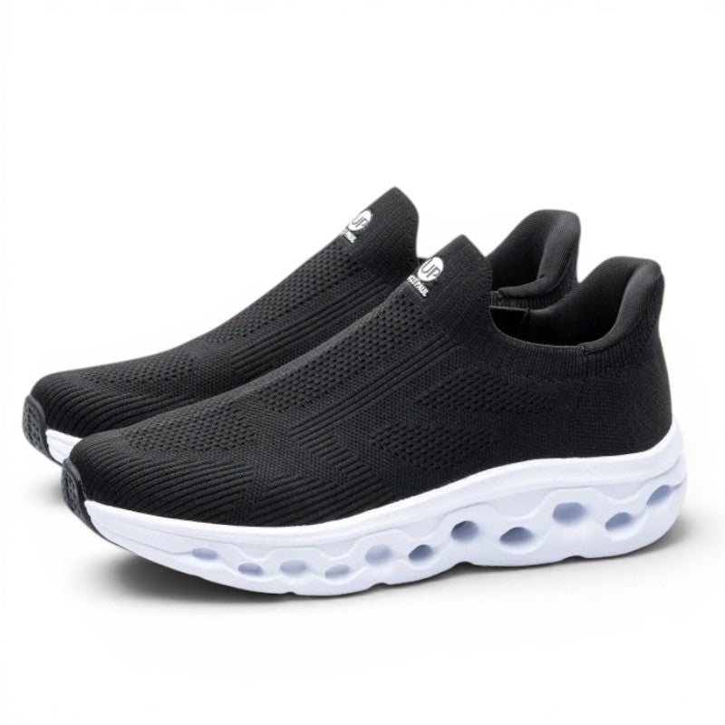 ShoeShopHere black textile slip-on sneakers with white cushioned sole and breathable flyknit upper.